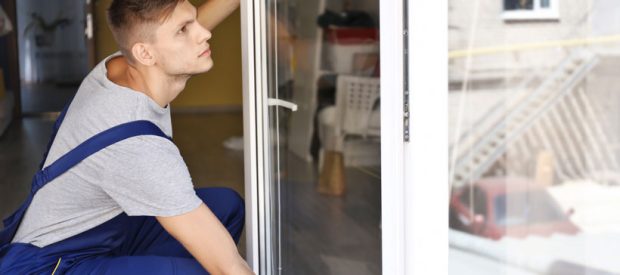 A skilled installer doing careful installation of window